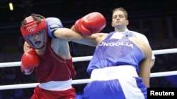 Azerbaijan's Elvin Mamishzada (left) boxes Mongolia's Tugstsogt Nyambayar in London. No word yet from Azerbaijan if anyone was watching.