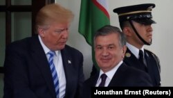 U.S. President Donald Trump (left) greets Shavkat Mirziyoev during the Uzbek president's visit to the White House in May. 