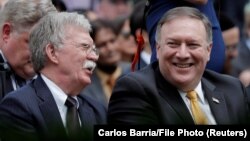 U.S. Secretary of State Mike Pompeo (right) and national-security adviser John Bolton (file photo)