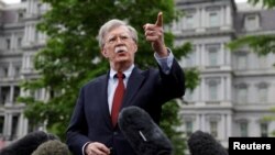 FILE PHOTO: U.S. national security adviser John Bolton talks to reporters at the White House in Washington, U.S., May 1, 2019. REUTERS/Kevin Lamarque/File Photo