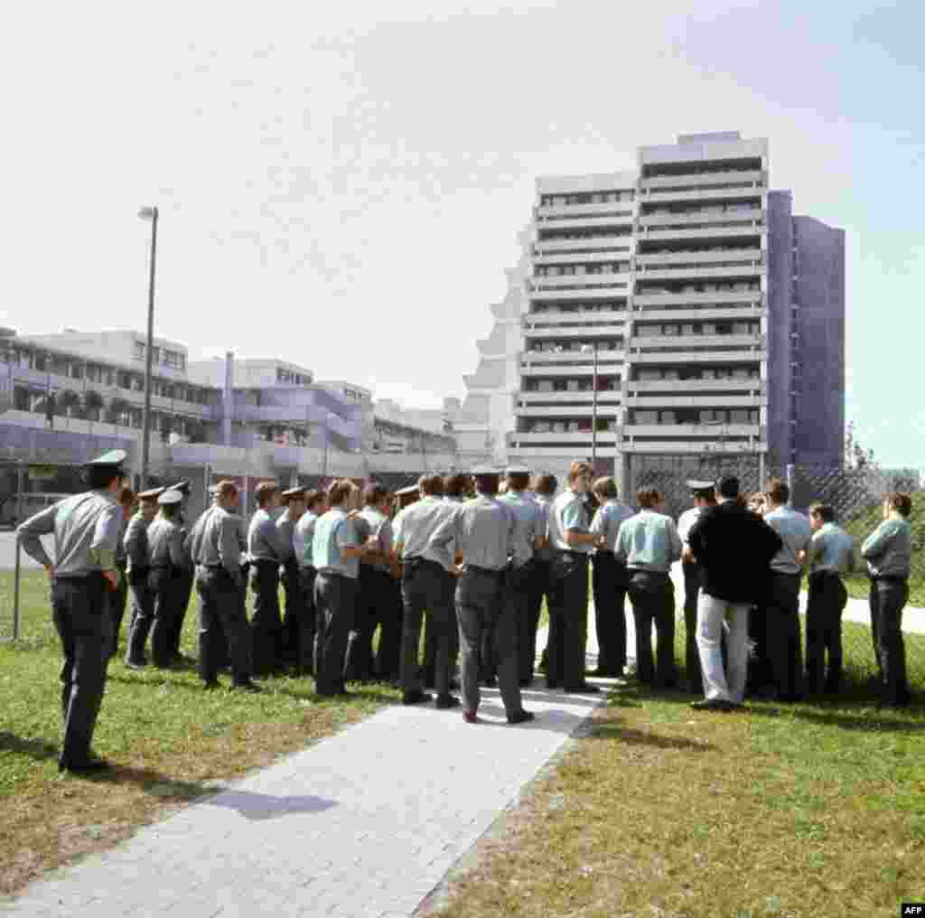 German police stand guard on September 6, 1972 at the fence demarcating the Munich Olympic village.