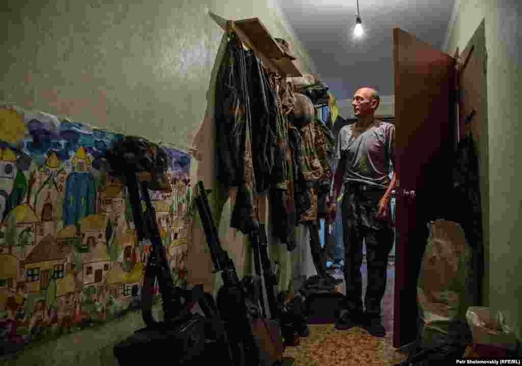 A Ukrainian serviceman at an apartment in Avdiyivka.