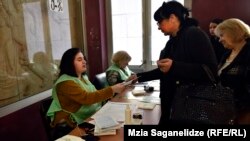 Voters cast ballots in the capital, Tbilisi, on October 21.
