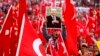 Germany, Cologne, a supporter of Turkish President Tayyip Erdogan holds up a picture during a pro-government protest on July 31.