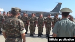 Armenia - Armenian army sergeants are about to board a U.S. military transport plane at Yerevan airport, 4Aug2016.