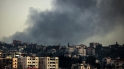 Smoke rises from the site of an Israeli air strike that targeted the southern Lebanese town of Deir al-Zahrani on April 15.