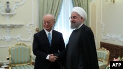 د ایران ولسمشر حسن روحاني او د نړیوالې اټمي ادارې رئیس یوکیو امانو