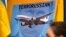  Зображення очільника Росії Володимира Путіна на плакаті учасників акції