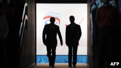 Murky dealings in the corridors of power? At last year's United Russia congress Dmitry Medvedev (right) effectively relinquished the presidency to Vladimir Putin. 