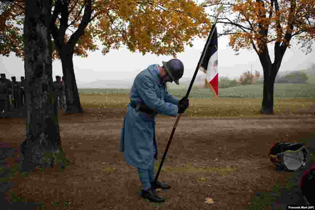 A military reenactment actor waits for the arrival of French President Emmanuel Macron during a ceremony marking the centenary of the end of World War I in the town of Morhange in eastern France. (AP/Francois Mori)