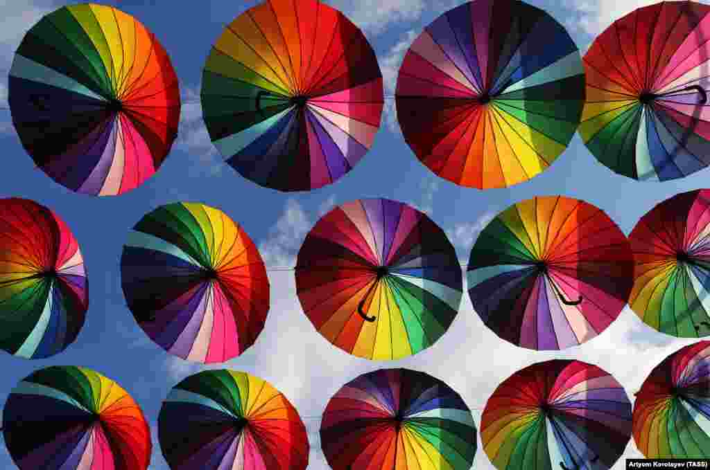 Colorful umbrellas hang above Nizhneimeretinskaya Street in the Russian city of Sochi. (TASS/Artyom Korotayev)
