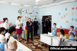 Mirziyoev visits an orphanage in Tashkent in July.