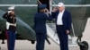 US President Donald Trump salutes an Air Force colonel before boarding the Marine One helicopter on May 25.