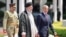 Iranian President Ebrahim Raisi (center) walks with Pakistani Prime Minister Shehbaz Sharif (right) to inspect a guard of honor in Islamabad on April 22.