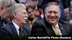 U.S. Secretary of State Mike Pompeo (right) and national-security adviser John Bolton (file photo)