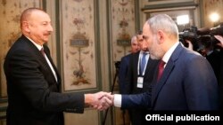 Germany -- Armenian Prime Minister Nikol Pashinian (R) and Azerbaijani President Ilham Aliyev meet in Munich, February 15, 2020.