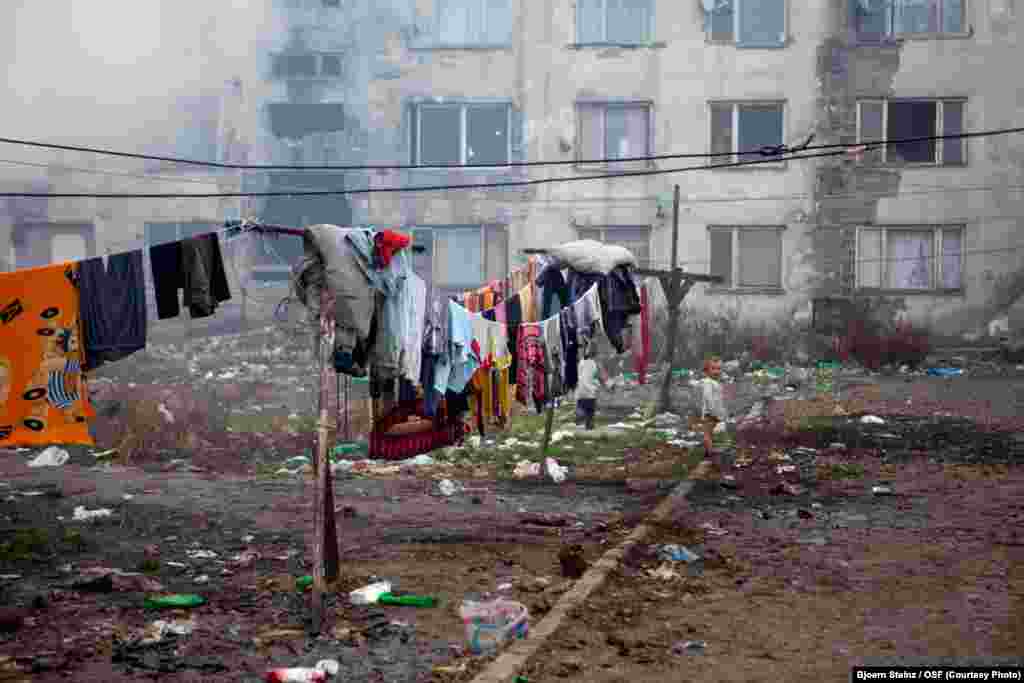 Clothes dry outside a partly abandoned apartment block on Budulovskej Street.