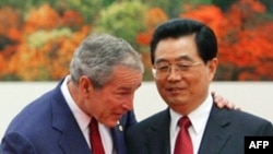 Presidents Bush (left) and Hu on August 8 