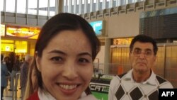 Roxana Saberi and her father, Reza, on arrival from Iran at Vienna's airport on May 15