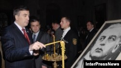 Georgian President Mikheil Saakashvili attends services ahead of the reburial of Zviad Gamsakhurdia in March 2007.