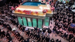 Shia Muslim devotees pray while attending a mourning ritual at the Karbala Mosque in Tehran on June 25 at the peak of Ashura, a 10-day period commemorating the seventh-century killing of Prophet Muhammad's grandson Imam Hussein.