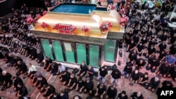 Shia Muslim devotees pray while attending a mourning ritual at the Karbala Mosque in Tehran on June 25 at the peak of Ashura, a 10-day period commemorating the seventh-century killing of Prophet Muhammad's grandson Imam Hussein.