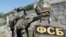 The six men were taken away by officers of Russia's Federal Security Service. (file photo)
