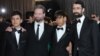 Actors Fawad Mohammadi (second from right) and Jawanmard Paiz (left) arrive with director Sam French (second from left) and producer Ariel Nasr on the red carpet for the 85th annual Academy Awards.