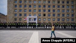 Police guard the entrance to the Chancellery building in Tbilisi on June 4.