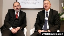 Armenian Prime Minister Nikol Pashinian (left) and Azerbaijani President Ilham Aliyev are shown during a meeting in Davos, Switzerland, in January.