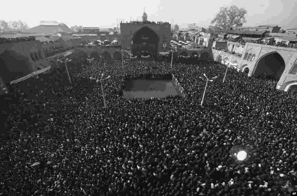 More than 100,000 people gathered outside Tehran's Bazaar Mosque on January 15, 1979. Troops stood by as demonstrators showered them with flowers and kisses while chanting "Long Live Khomeini" and "Death to the Shah."