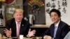 U.S. President Donald Trump talks with Japanese Prime Minister Shinzo Abe during a couples dinner with first lady Melania Trump and Abe's wife Akie in Tokyo, May 26, 2019