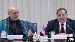 U.S. Defense Secretary Leon Panetta (right) with Afghan President Hamid Karzai during their meeting at the Pentagon.