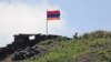 ARMENIA -- An Armenian flag flies at an Armenian army post on the border with Azerbaijan, in Gegharkunik province, June 18, 2021