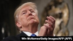 U.S. President Donald Trump claps during the State of the Union address in the chamber of the U.S. House of Representatives on January 30.