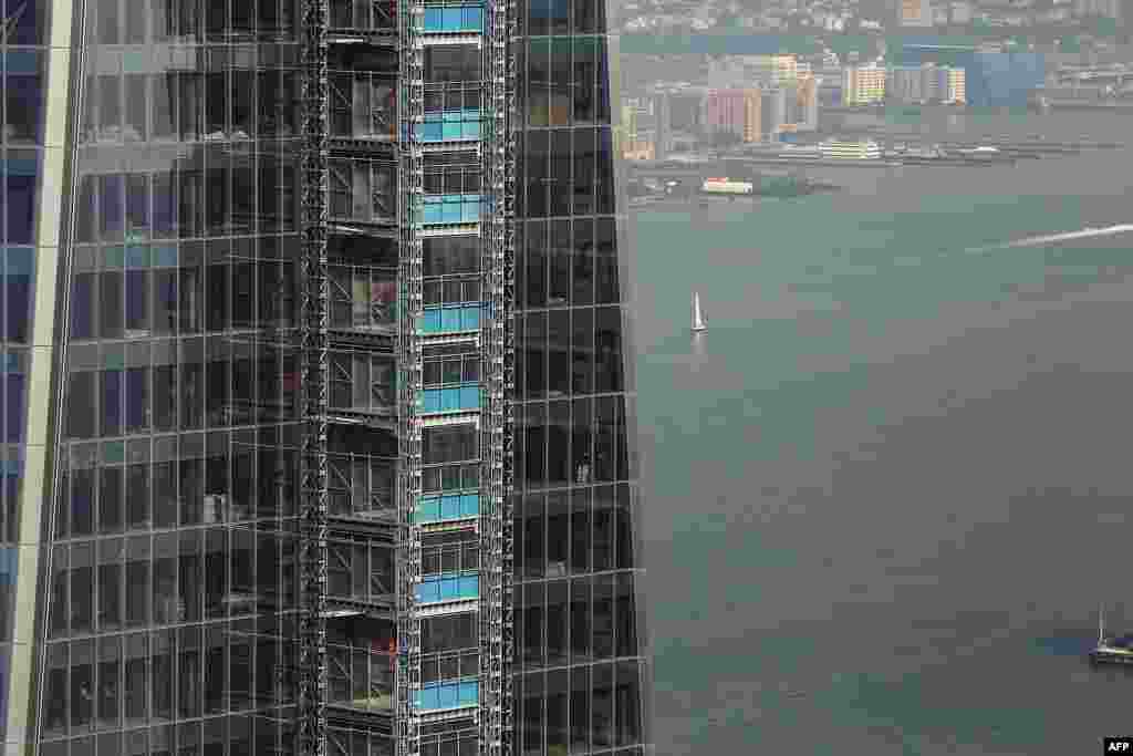 One World Trade Center is seen from the 72nd floor of a neighboring tower, Four World Trade Center. The reconstruction project at the site of the attacks has a projected price tag of $14.8 billion.