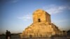 An Iranian family poses for a picture on May 19, 2015, next to the tomb of Cyrus the Great of Persia.