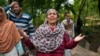 A woman reacts after her house was damaged by Pakistani artillery shelling in Uri, a village north of Srinagar in Indian-controlled Kashmir