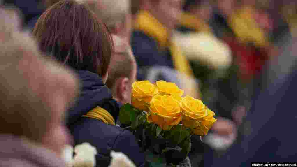 More mourners at the ceremony.