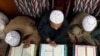 Students study the Koran at a religious school run by a religious scholar and leader of the political party Jamiat Ulam-e Islam at Akora Khattak.