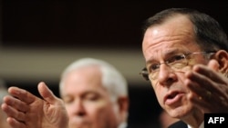 U.S. Chairman of the Joint Chiefs of Staff Admiral Mike Mullen testifies before the Senate Armed Services Committee on February 2, with Defense Secretary Robert Gates looking on.