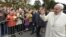 Pope Francis greets well-wishers as he arrives at the Monument of Freedom in Riga on September 24.
