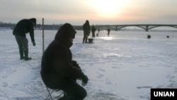 Fishermen on the frozen Dnieper River in Kyiv