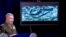 Video of the Abu Bakr al-Baghdadi raid is displayed as U.S. Central Command Commander Marine Gen. Kenneth McKenzie speaks, Wednesday, Oct. 30, 2019, at a joint press briefing at the Pentagon in Washington.
