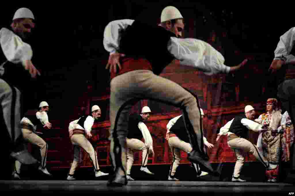 Members of Kosovo&#39;s national state song and dance Shota ensemble perform at the national theater in Pristina. (AFP/Armend Nimani)