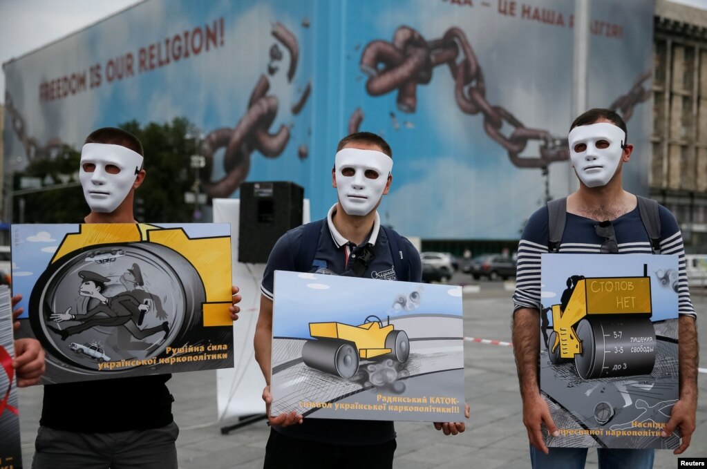 Activists campaigning for a better legal treatment of drug offenders take part in a performance to mark the International Day against Drug Abuse and Illicit Trafficking and the International Day in Support of Victims of Torture in Kyiv on June 26. (Reuters/Gleb Garanich)