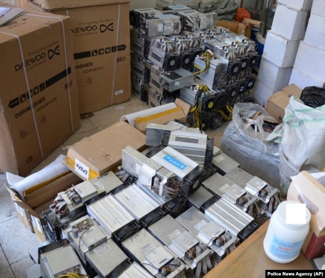 A photo provided by the Iranian police shows boxes of machinery used in Bitcoin mining operations that were confiscated by the authorities in Nazarabad.