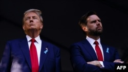 (FILES) Former US President and Republican presidential candidate Donald Trump (L) and US Senator from Ohio and Republican vice presidential candidate J.D. Vance attend a remembrance ceremony on the 23rd anniversary of the September 11 terror attack on th