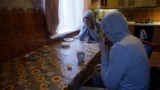 Russia -- Chechen gay men who fled persecution in their home Russia's Muslim region of Chechnya due to his sexual-orientation, sits around a table in their flat in Moscow, April 18, 2017