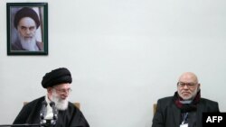 Ayatollah Ali Khamenei (left) is pictured here with a member of Egypt's Muslim Brotherhood. Khamenei says the revolts sweeping the Arab world have a spiritual kinship with Iran's own 1979 revolution. 